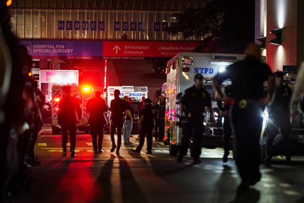 NYPD officers wait for the ambulance transfer of slain NYPD officer Didarul Islam,  in New York City