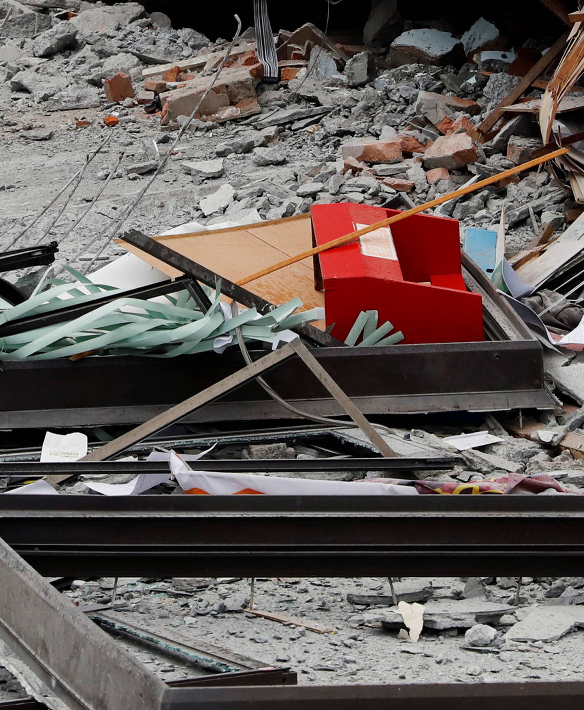 Debris are seen outside a damaged hotel after an earthquake hit Hualien