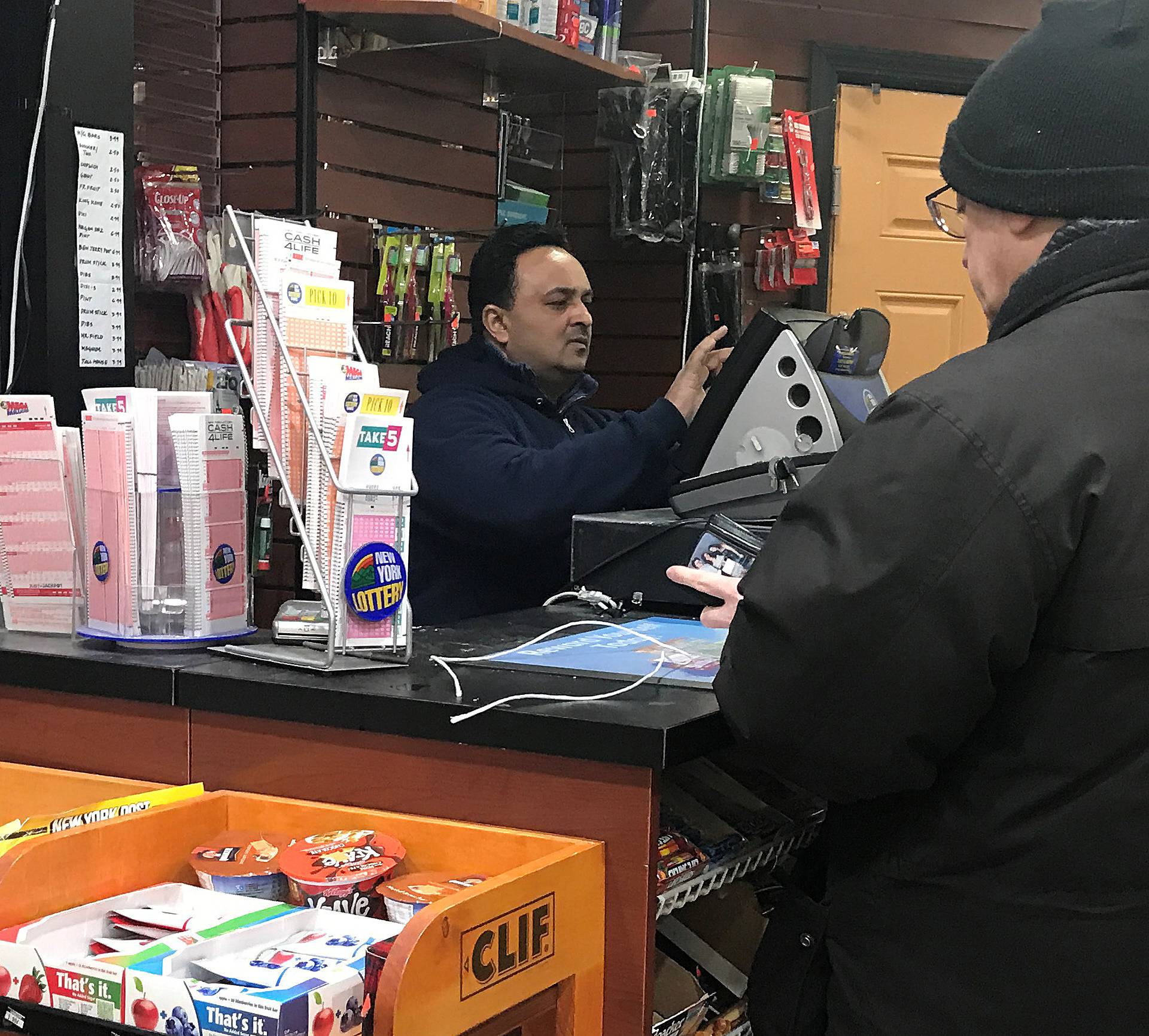 A lottery retailer sells Powerball and Mega Millions tickets to a customer in New York City