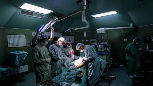 British vascular surgeon John Wolfe performs a surgery in Gaza
