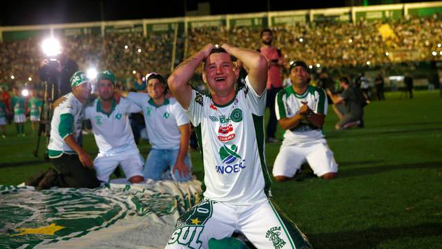 Fans of Chapecoense soccer team pay tribute to Chapecoense's players at the Arena Conda stadium in Chapeco