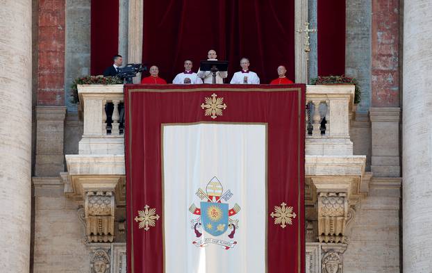 Pope Francis leads the "Urbi et Orbi" message from the balcony overlooking St. Peter