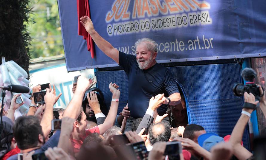 Former Brazilian President Luiz Inacio Lula da Silva is carried by supporters in front of the metallurgic trade union in Sao Bernardo do Campo