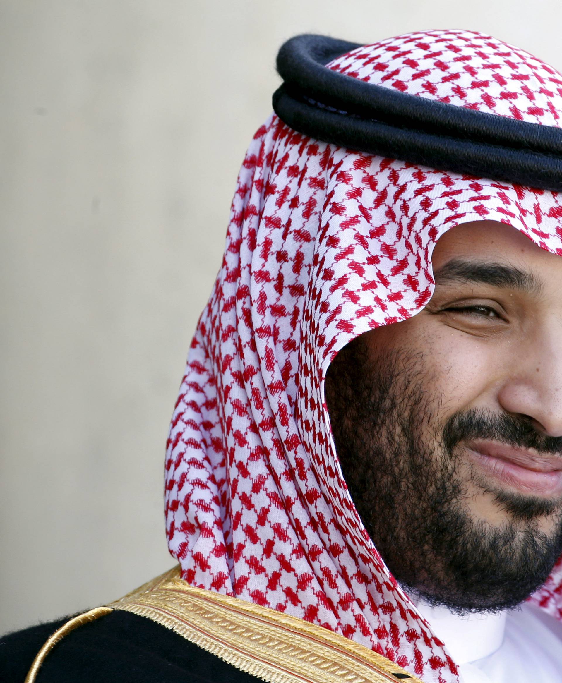 FILE PHOTO:Saudi Arabia's then Deputy Crown Prince Mohammed bin Salman reacts upon his arrival at the Elysee Palace in Paris
