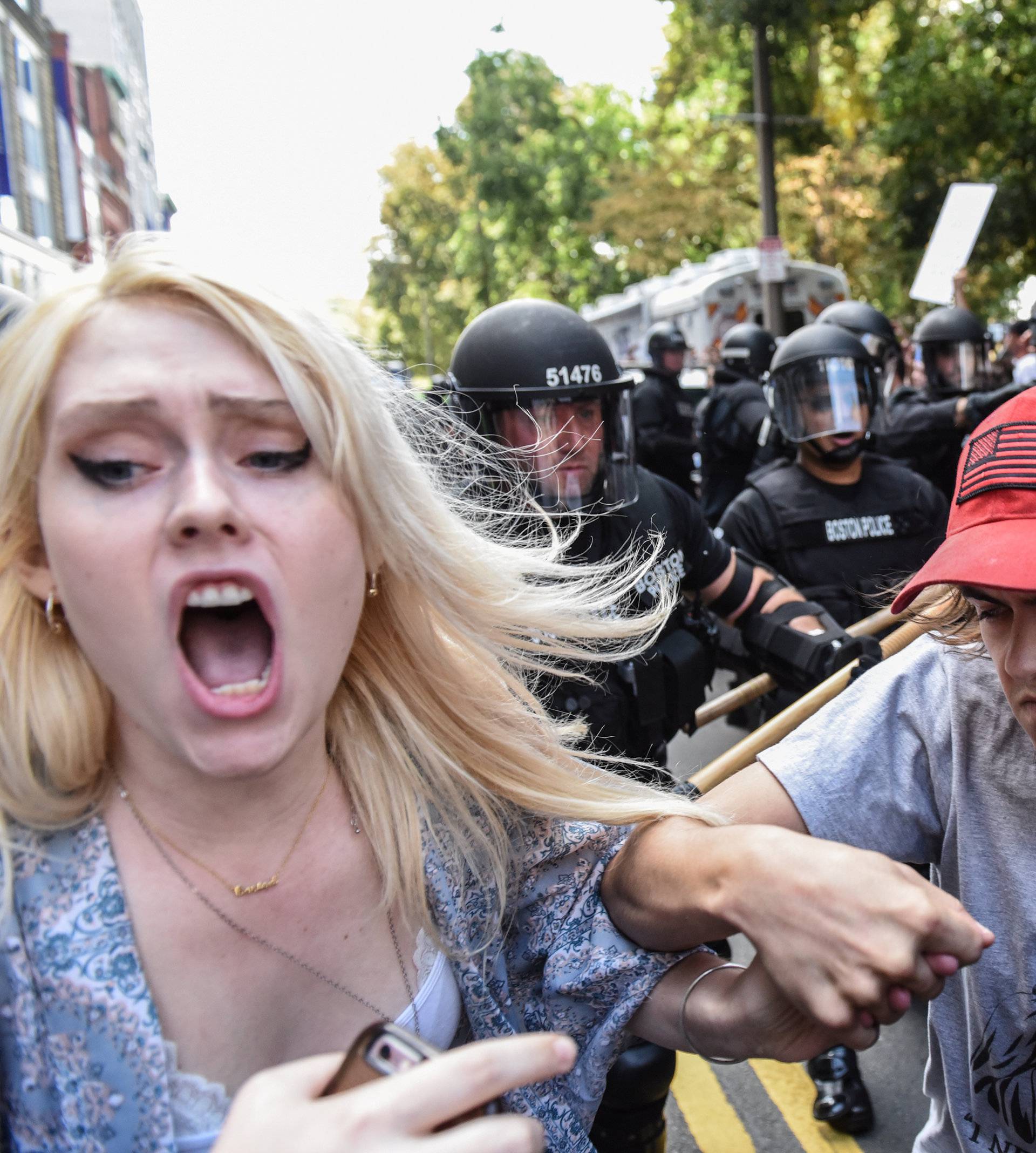 Counter protesters clash with Boston Police outside of the Boston Commons and the Boston Free Speech Rally in Boston, Massachusetts