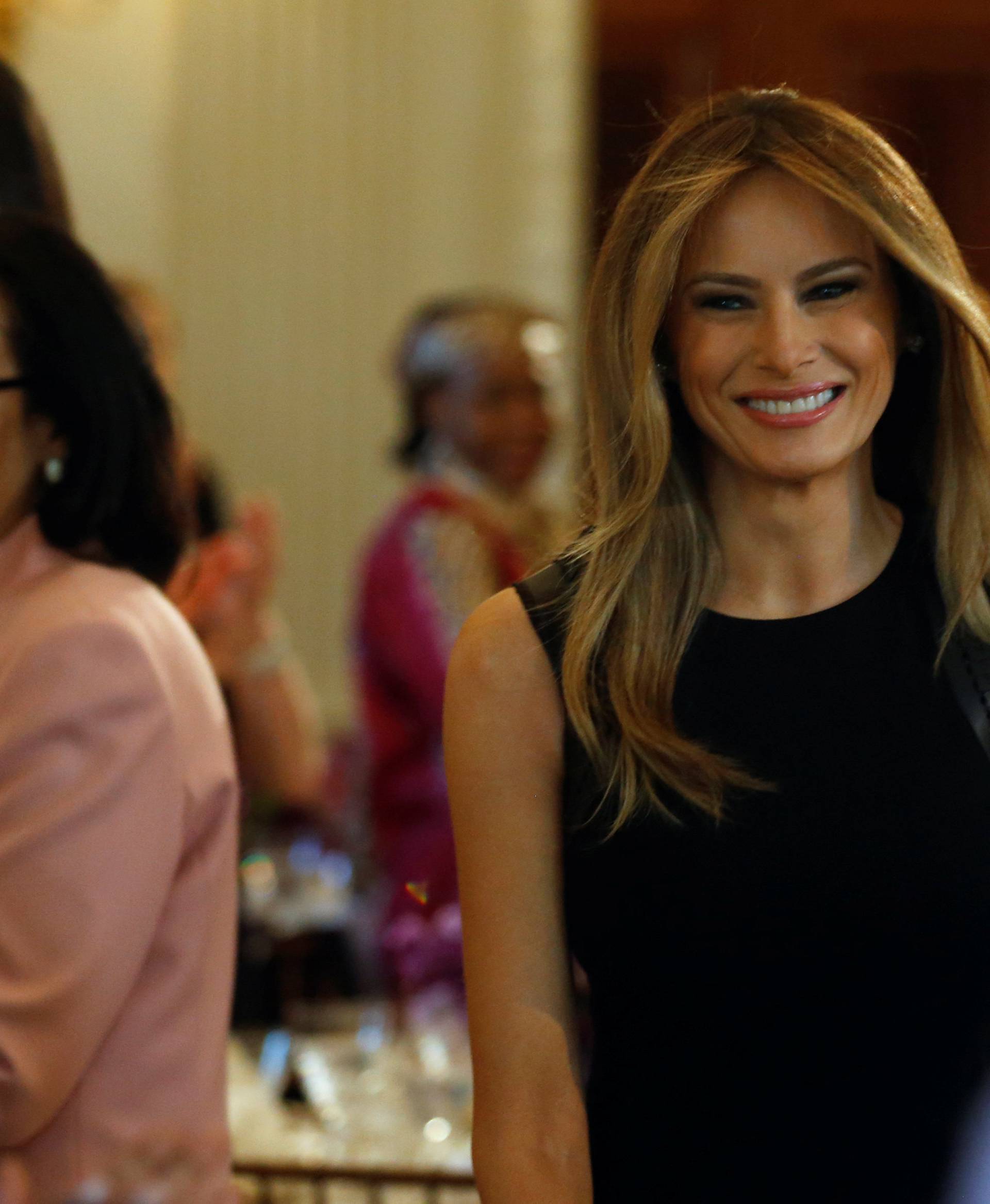 Melania Trump arrives to join her guests for an International Women's Day luncheon at the White House in Washington