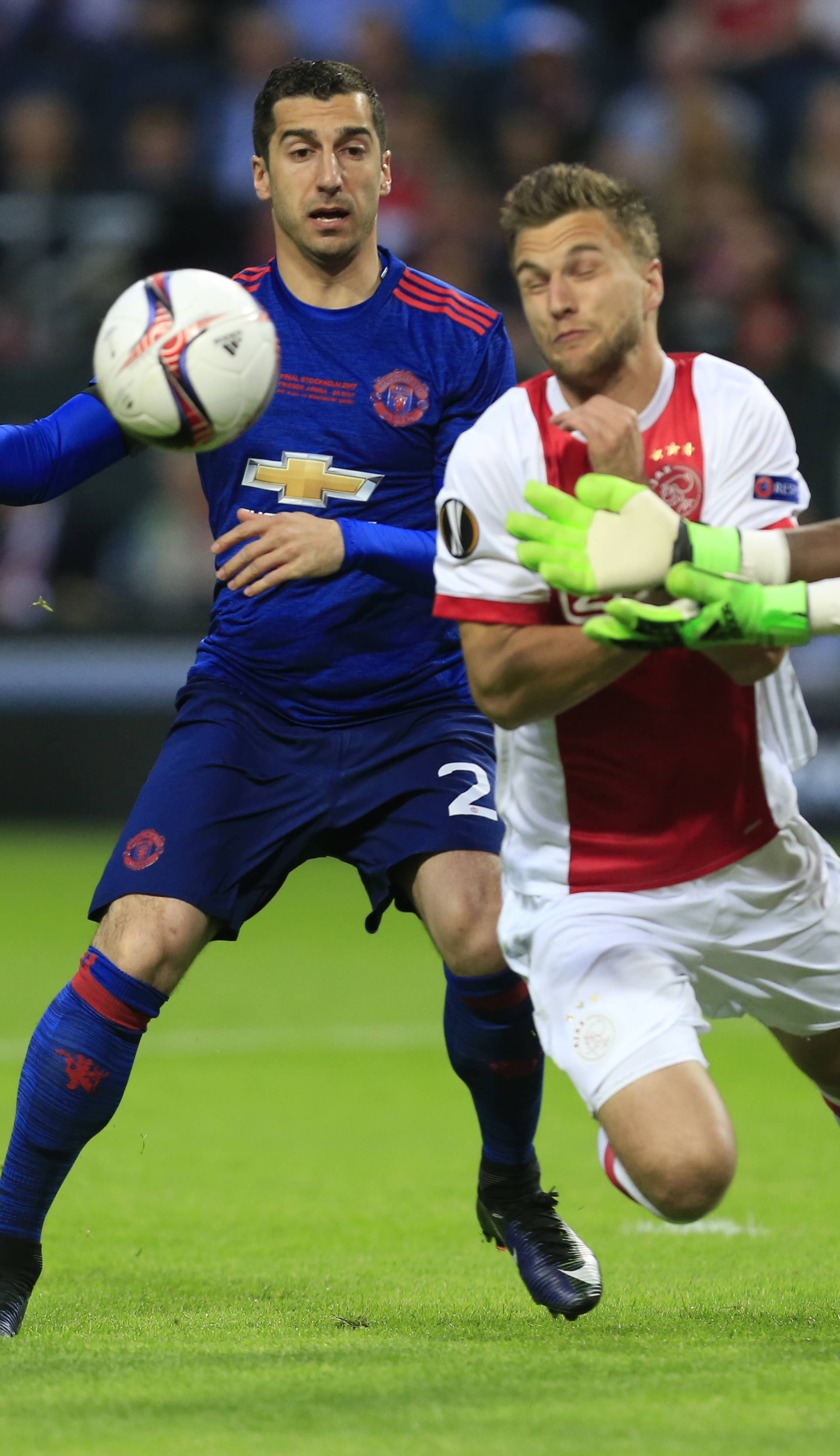 Ajax's Joel Veltman and Andre Onana in action with Manchester United's Henrikh Mkhitaryan