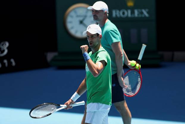 Serbian tennis player Novak Djokovic practices at Melbourne Park as questions remain over the legal battle regarding his visa to play in the Australian Open