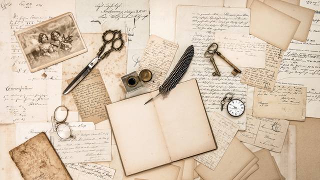 Old handwritten letters, pictures and antique writing accessories