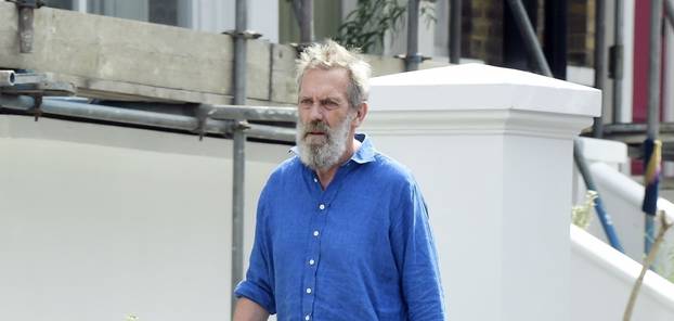 *EXCLUSIVE* STRICTLY NOT AVAILABLE FOR ONLINE USAGE UNTIL 22:00 PM UK TIME ON 02/08/2022 - WEB MUST CALL FOR PRICING  - The English Actor Hugh Laurie cuts a rather dishevelled look during his jaunt out walking the dog in North London.*PICTURES TAEKN ON