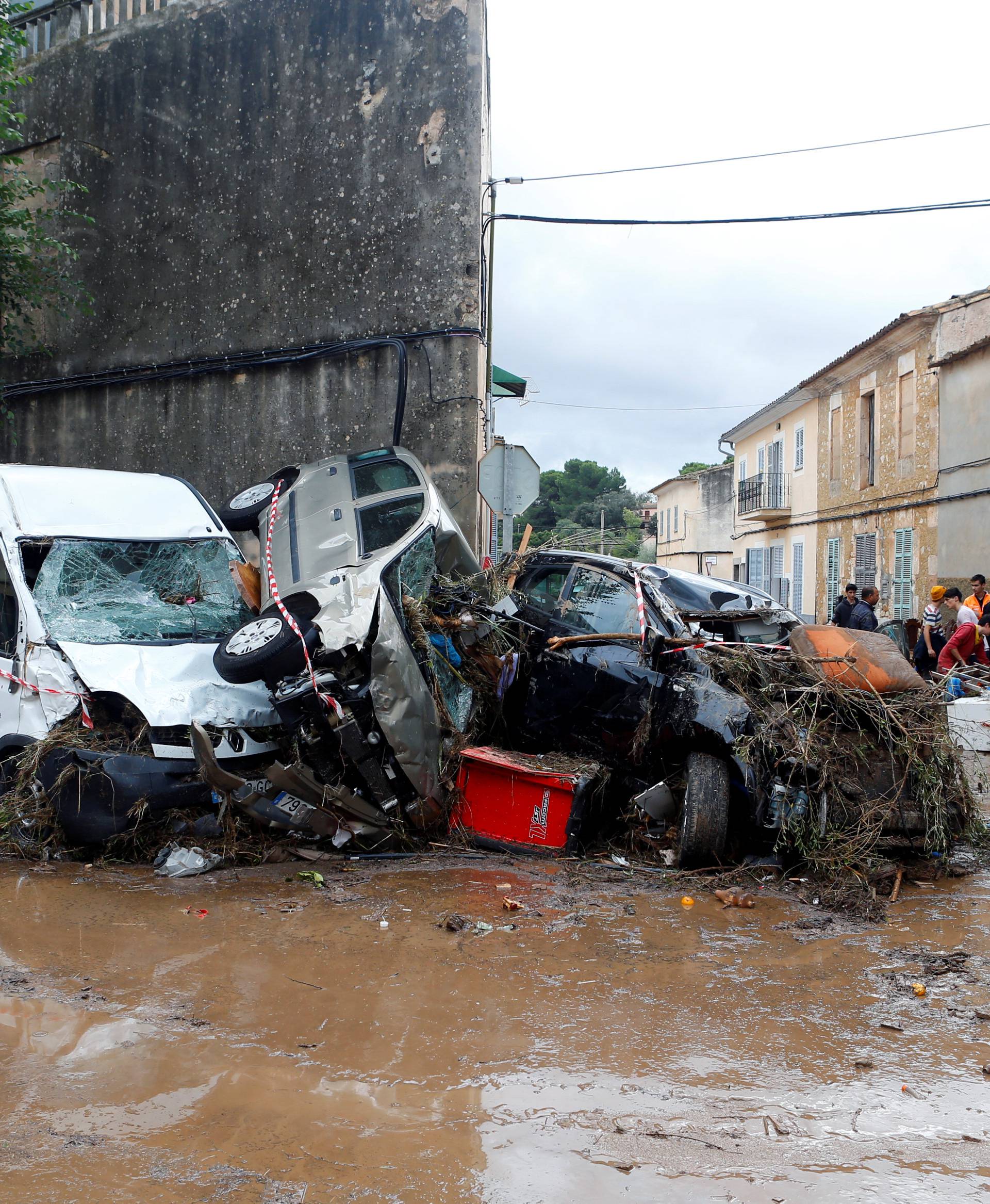 Destroyed cars are seen on the streets as heavy rain and flash floods hit Sant Llorenc de Cardassar on the island of Mallorca