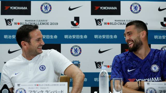 Chelsea manager Frank Lampard laughs with his player Mateo Kovacic during a news conference ahead of their pre-season match against Japan's Kawasaki Frontale in Yokohama