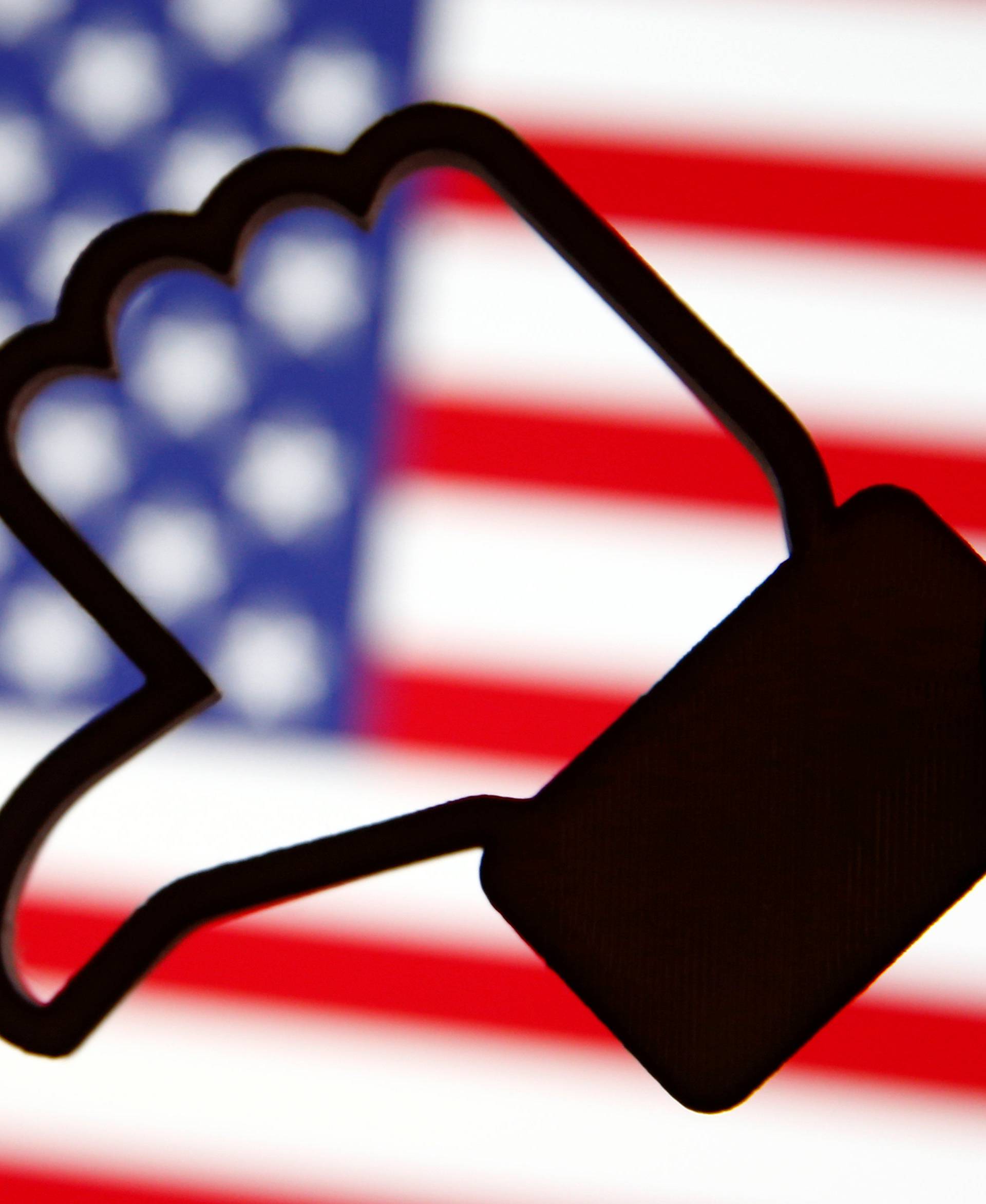 A 3D-printed Facebook Like symbol is displayed inverted in front of a U.S. flag in this illustration