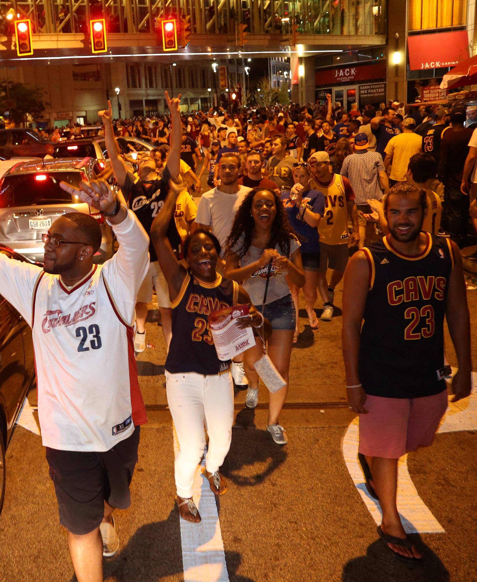 Cleveland Cavaliers fans celebrate in the streets outside of Quicken Loans Arena in Cleveland