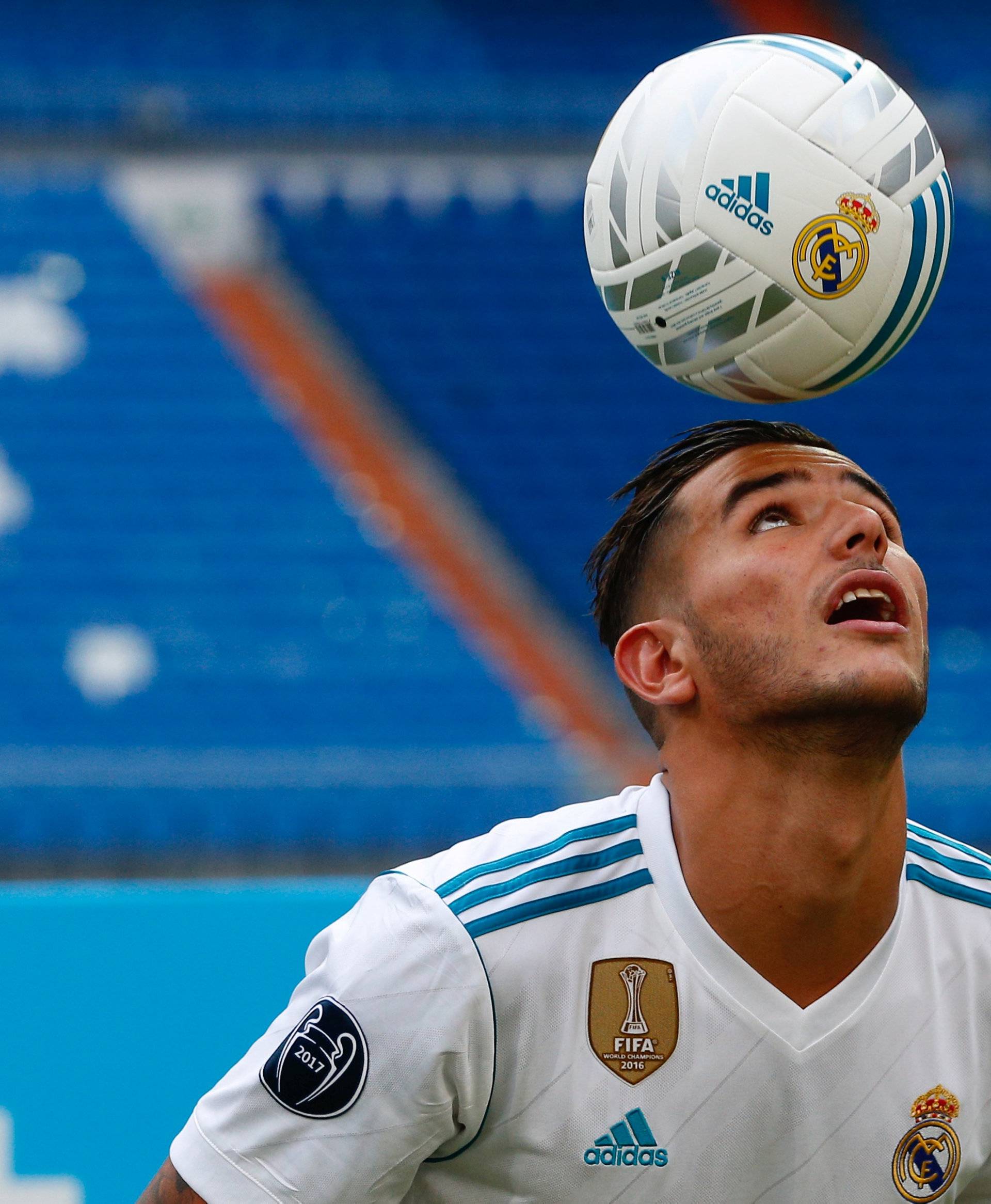 Real Madrid's new player Theo Hernandez heads the ball during his presentation at the Santiago Bernabeu Stadium in Madrid