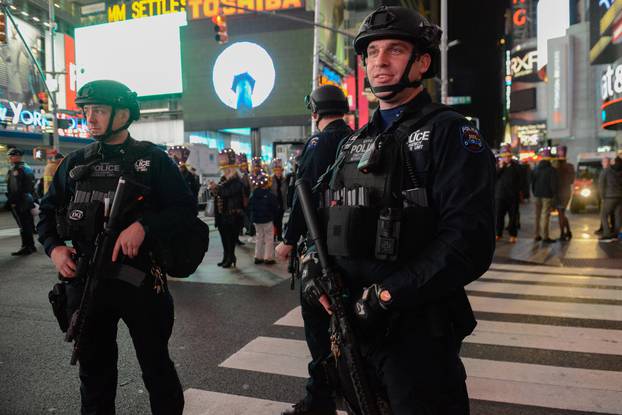 Members of the counter terrorism task force stand guard in Times Square on New Year