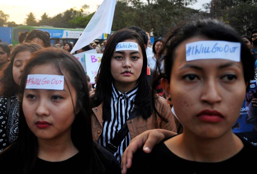 Women take part in the #IWillGoOut rally, to show solidarity with the Women's March in Washington, along a street in Bengaluru