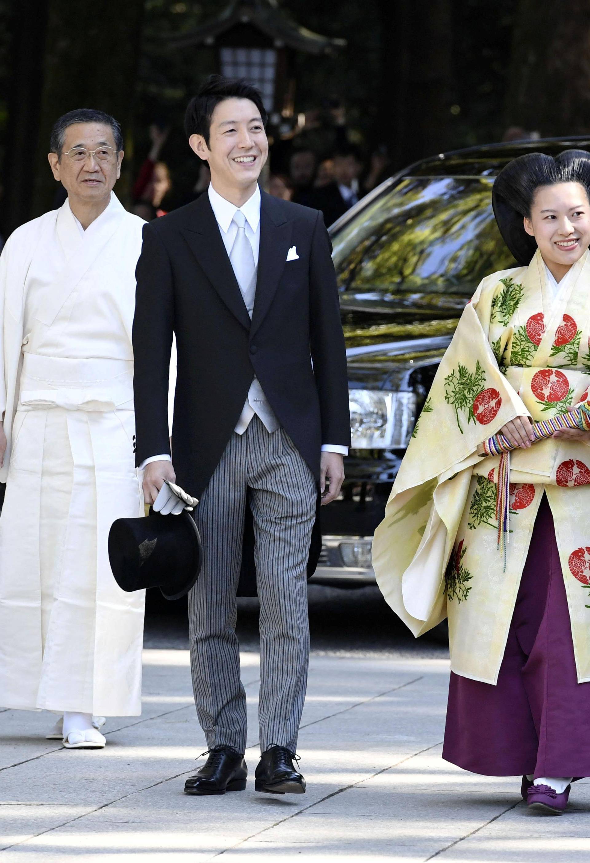 Japanese Princess Ayako and her husband-to-be Kei Moriya arrive at the Meiji Shrine for wedding ceremony in Tokyo