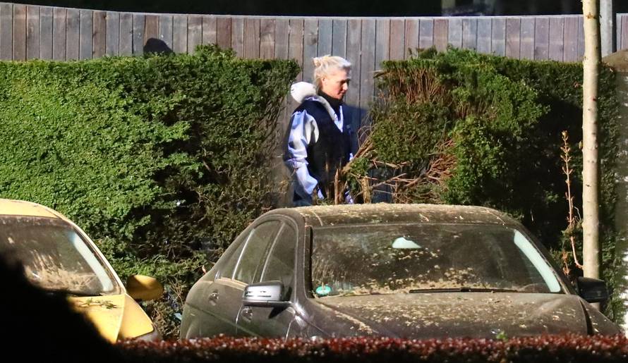 Forensic experts search the area where the expolsion occured