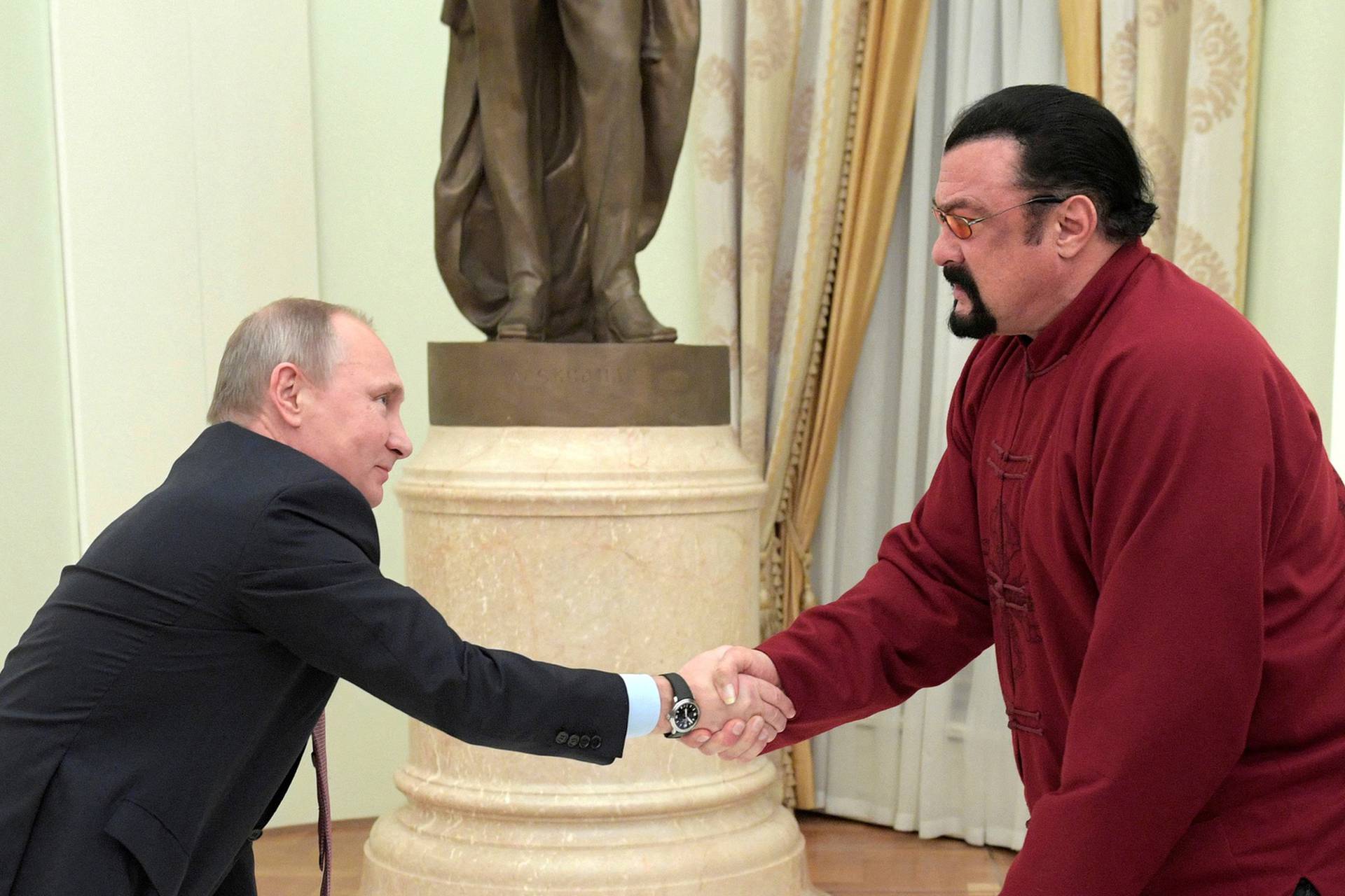 FILE PHOTO: Russia's President Putin meets U.S. actor Seagal in Moscow