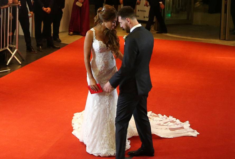 Argentine soccer player Lionel Messi and his wife Antonela Roccuzzo pose at their wedding in Rosario