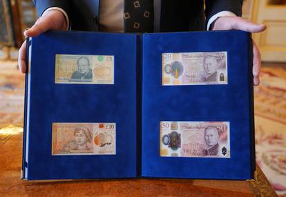 King Charles is presented with the first bank notes featuring his portrait in London