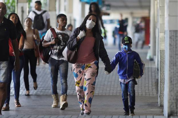 Passengers walk at Central do Brasil train station during the coronavirus disease (COVID-19) outbreak in Rio de Janeiro