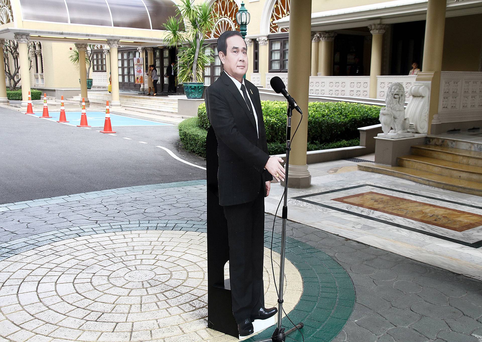 A cardboard cut-out of Thailand's Prime Minster Prayuth Chan-ocha is seen next to a microphone after a news conference at government house in Bangkok