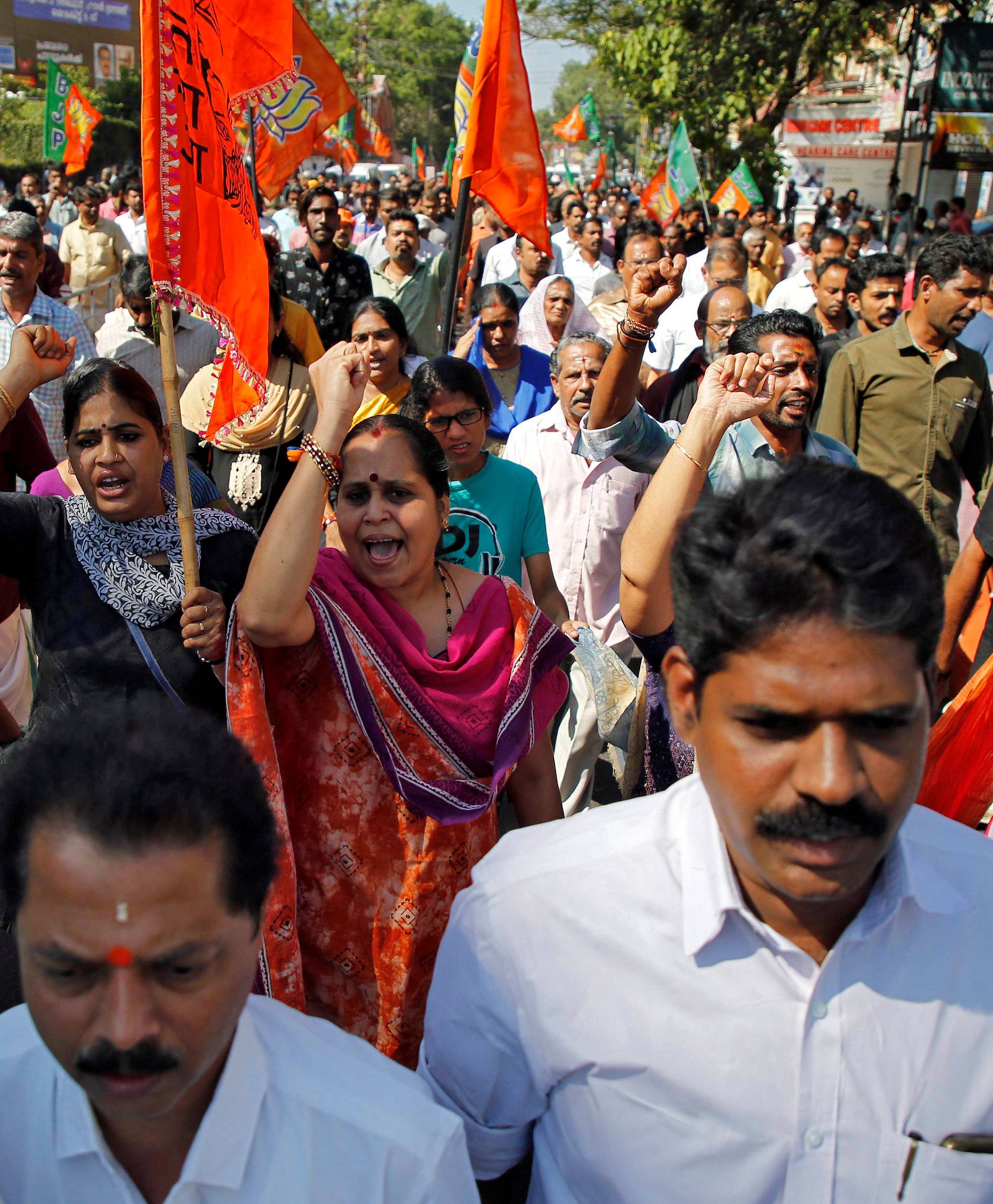 Supporters of BJP and Hindu nationalist organisation RSS attend a protest rally during a strike against the state government for allowing two women to defy an ancient ban and enter the Sabarimala temple, in Kochi