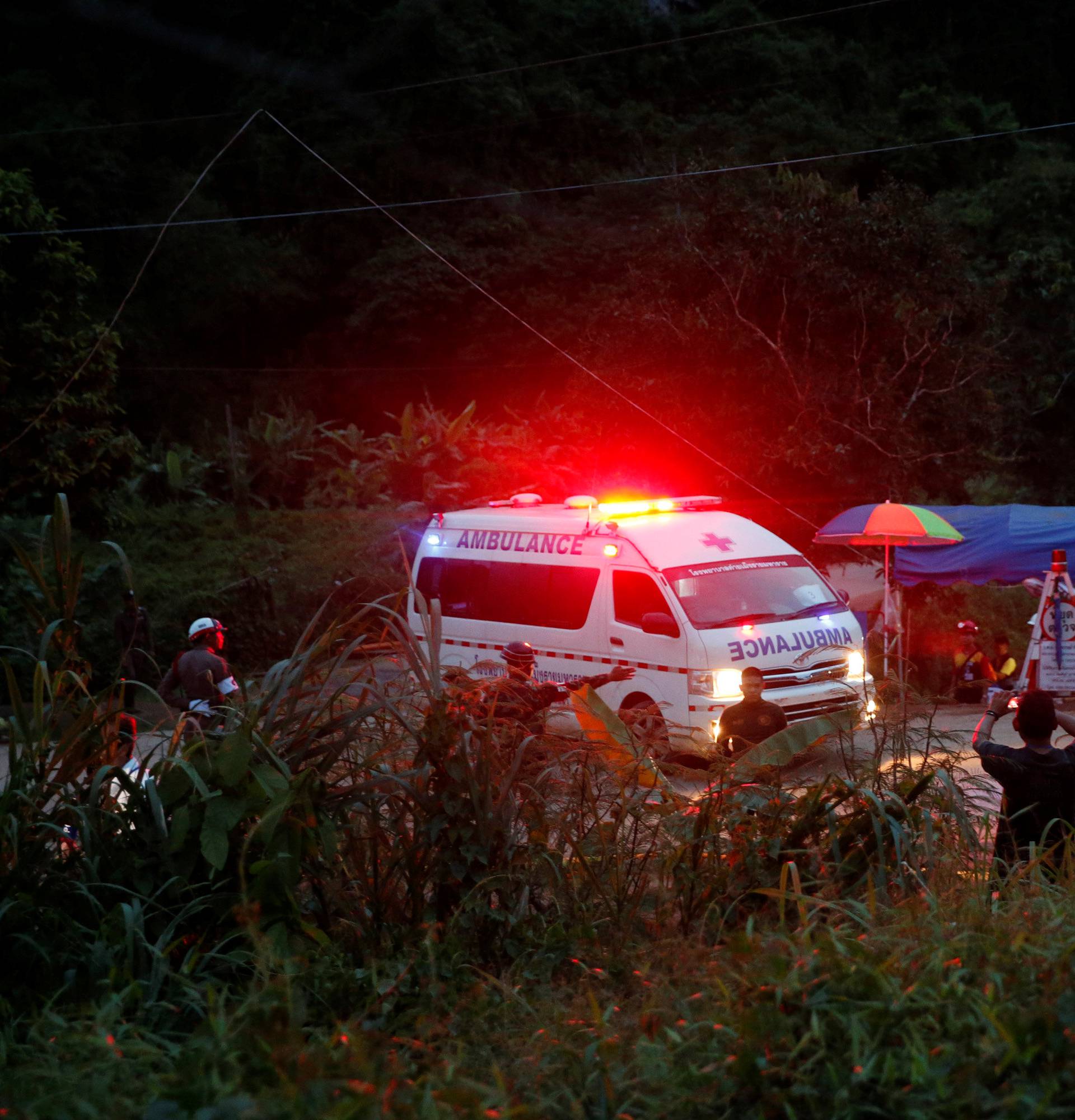 An ambulance leaves from Tham Luang cave complex in the northern province of Chiang Rai