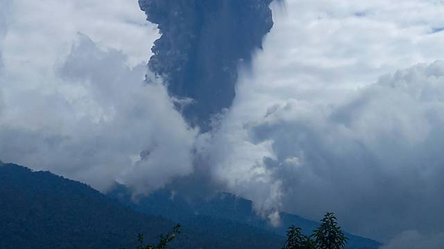 FILE PHOTO: Mount Marapi volcano spews volcanic ash as seen from Nagari Sungai Pua, in Agam