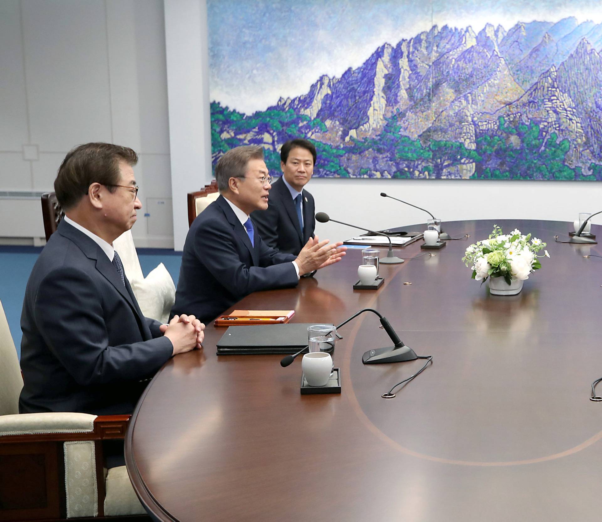 South Korean President Moon Jae-in talks with North Korean leader Kim Jong Un during their meeting at the Peace House