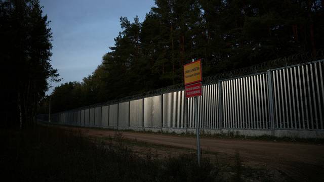 FILE PHOTO: General view of the fence on the Polish-Belarusian border at sunset, during the migrant crisis, in Opaka Duza