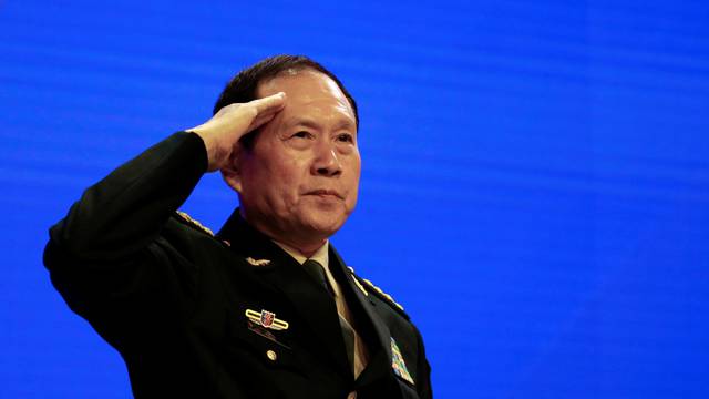 Chinese Defense Minister Wei Fenghe salutes at the IISS Shangri-la Dialogue in Singapore