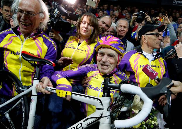 FILE PHOTO: French cyclist Robert Marchand, aged 105, reacts after he rode 22.528 km (14.08 miles) in one hour to set a new record at the indoor Velodrome National in Montigny-les-Bretonneux