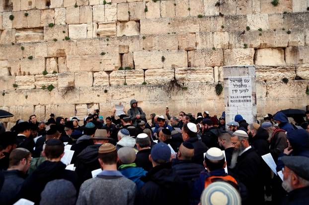 Jewish worshippers take part in a prayer for those affected by the coronavirus at the Western Wall in Jerusalem