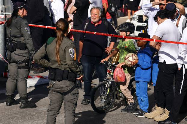 Israeli border police officers secure the scene following an incident by Jerusalem's main market