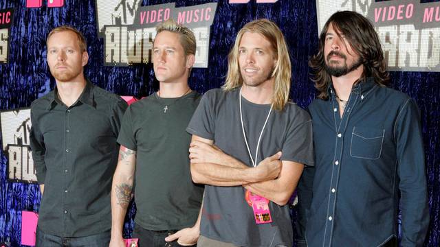 FILE PHOTO: Nate Mendel, Chris Shiflett, Taylor Hawkins and Dave Grohl of the band "Foo Fighters" arrive for the 2007 MTV Video Music Awards in Las Vegas