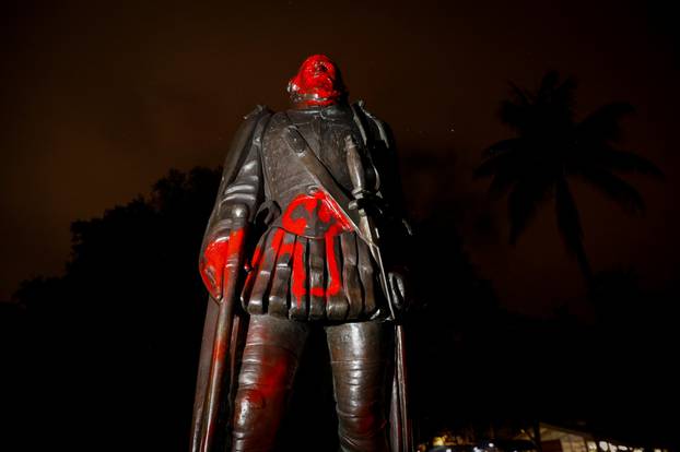 A vandalized statue of Christopher Columbus at the Bayside Marketplace in Downtown Miami
