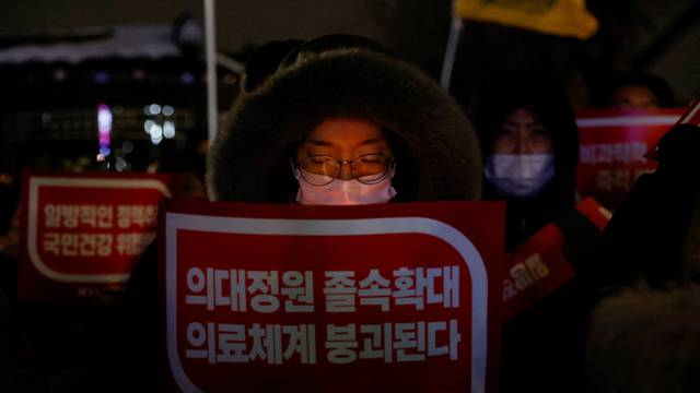 Doctors take part in a protest against a plan to admit more students to medical school, in front of the Presidential Office in Seoul
