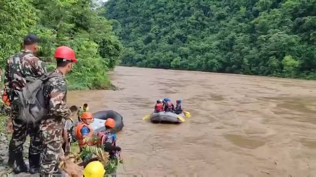 Nepal searches for survivors after landslide sweeps buses into river, 65 missing