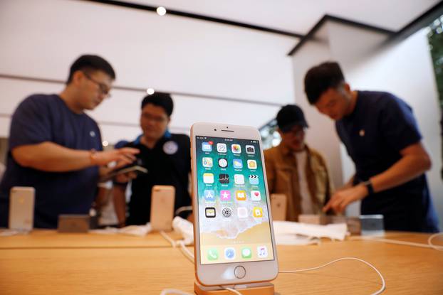 People buy the iPhone 8 at the Apple Orchard Shop in Singapore