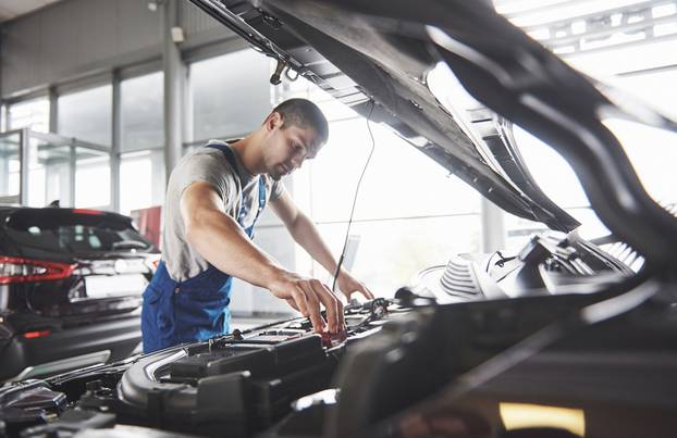 Picture,Showing,Muscular,Car,Service,Worker,Repairing,Vehicle.