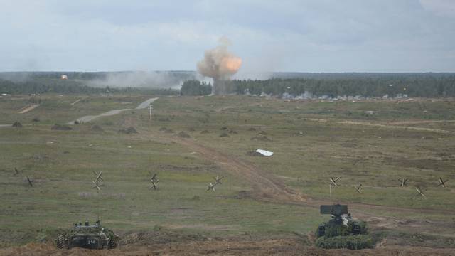 Armoured vehicles fire during the Zapad-2017 war games in Belarus