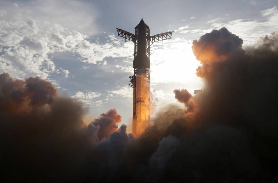A SpaceX Super Heavy booster carrying the Starship spacecraft lifts off on its 10th test flight