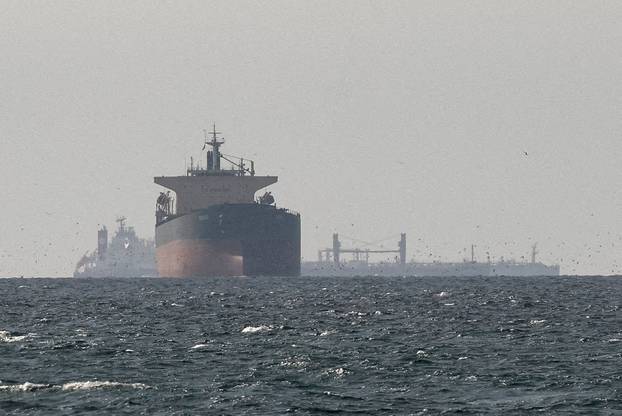 FILE PHOTO: Cargo ships in the Gulf, near the Strait of Hormuz