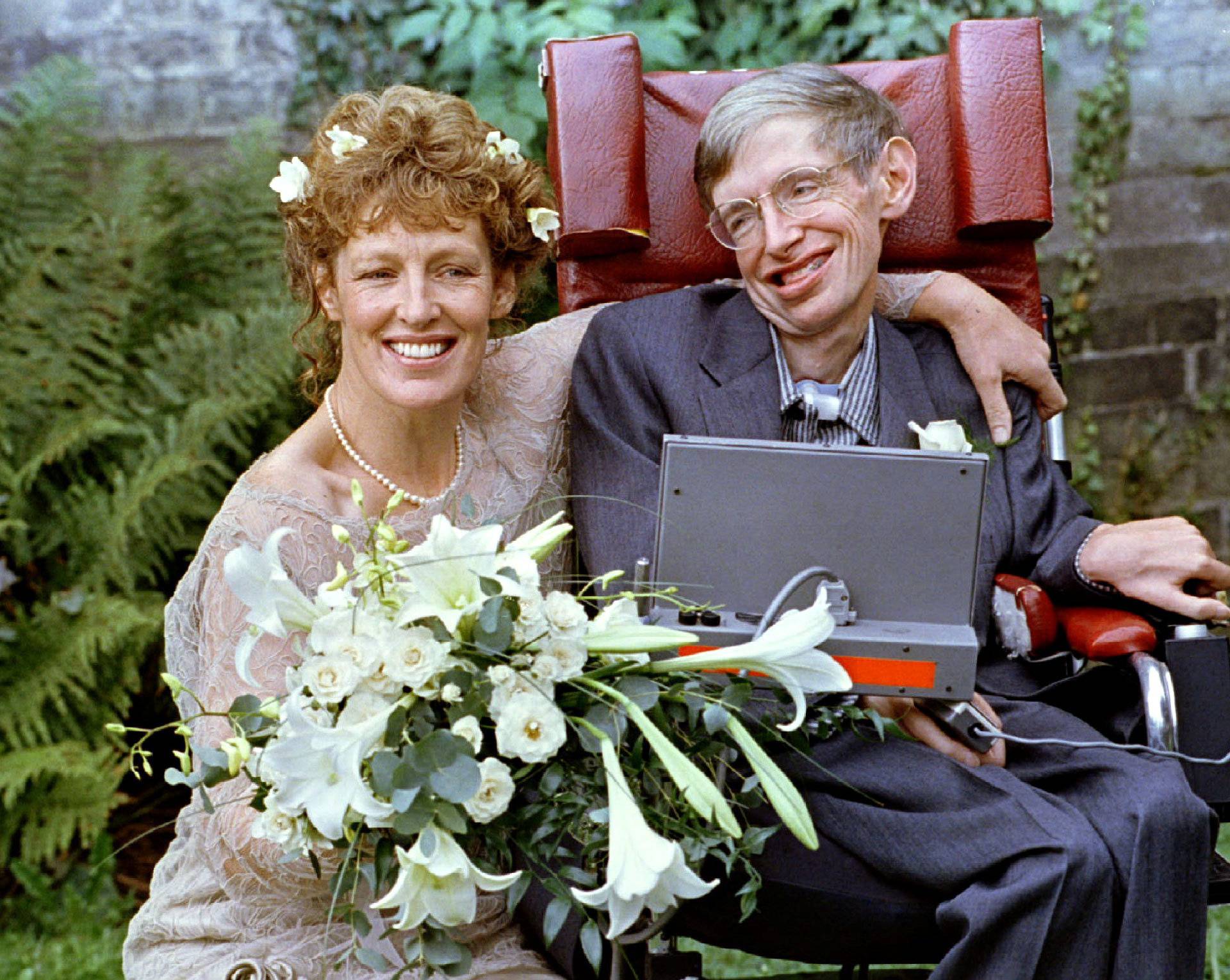 FILE PHOTO: Stephen Hawking and his new bride Elaine Mason pose for pictures after the blessing of their wedding at St. Barnabus Church