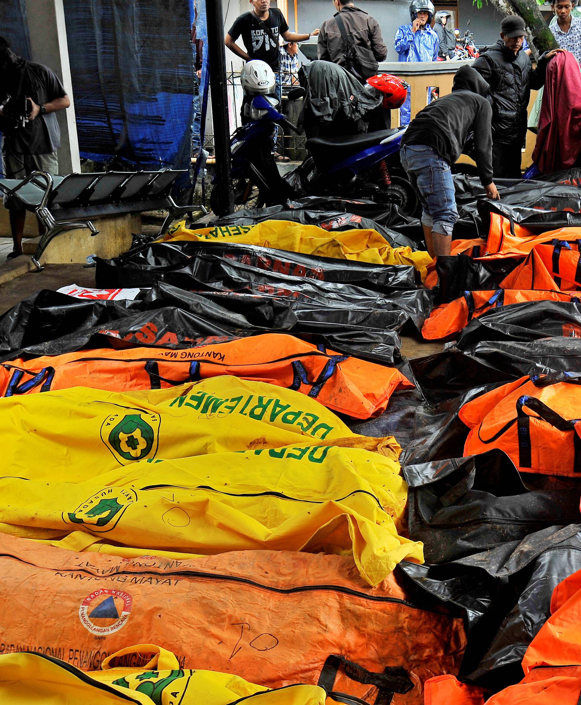 Bodies of tsunami victims are collected at a local health facility after a tsunami hit Carita in Pandeglang