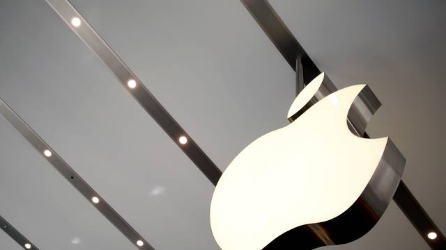 FILE PHOTO: Apple logo is pictured inside the newly opened Omotesando Apple store at a shopping district in Tokyo, Japan