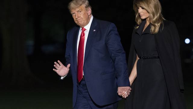 President Donald J. Trump  and First lady Melania Trump return to the White House